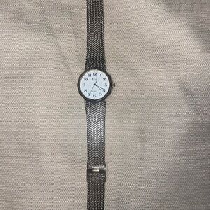 Koji watch silver tone stainless steel. Adjustable band.